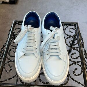 Baby blue Burberry sneakers.